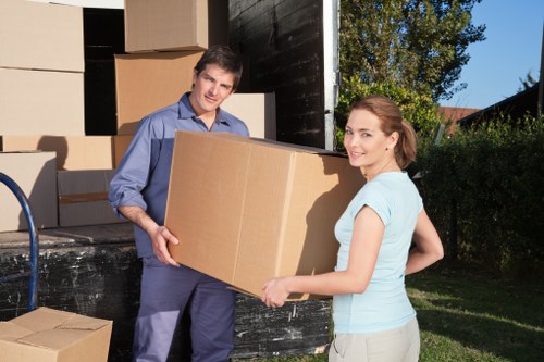 Staff reviewing storage safety procedures in a warehouse